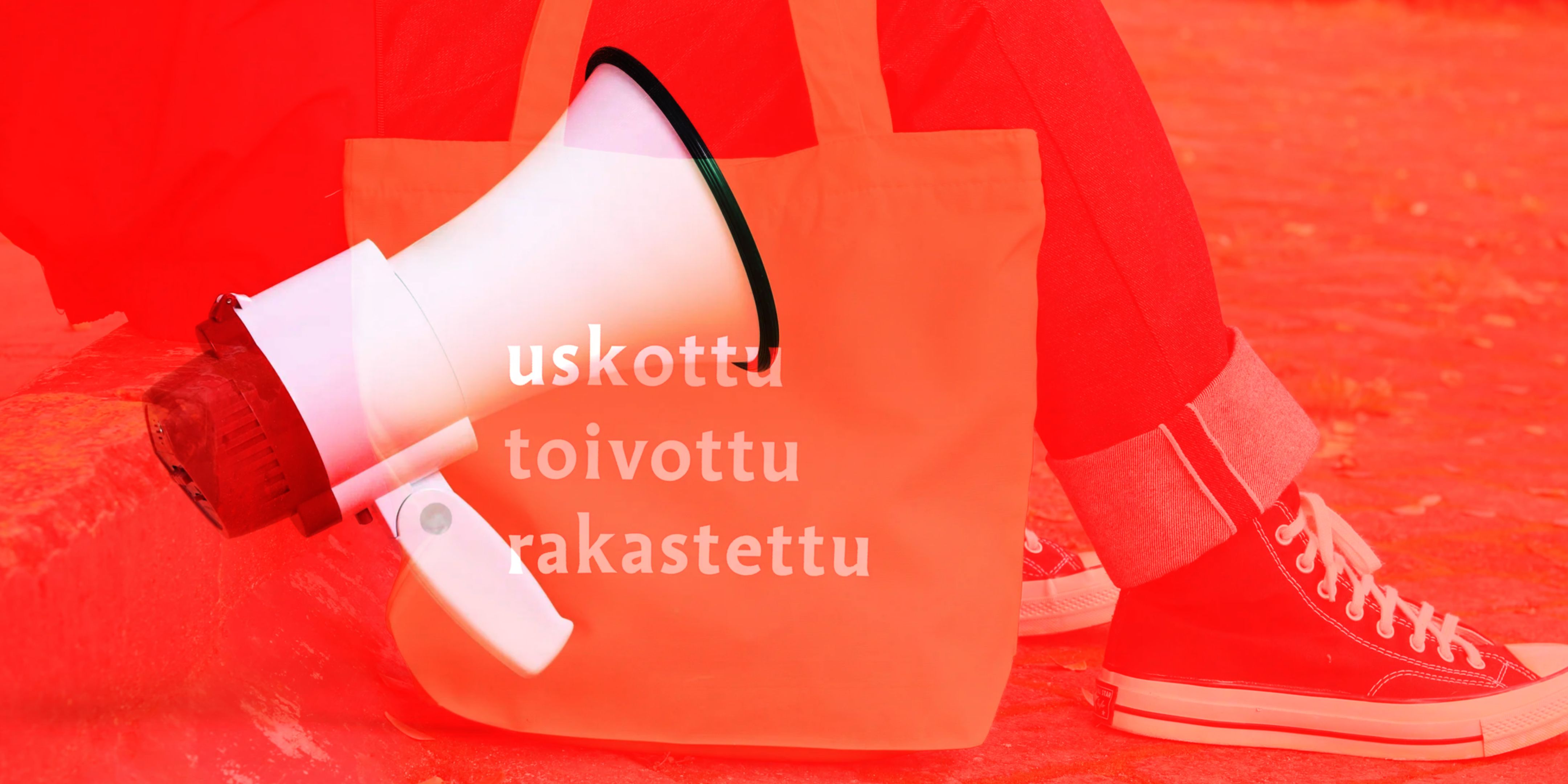 Valkoinen megafoni ja teksti 